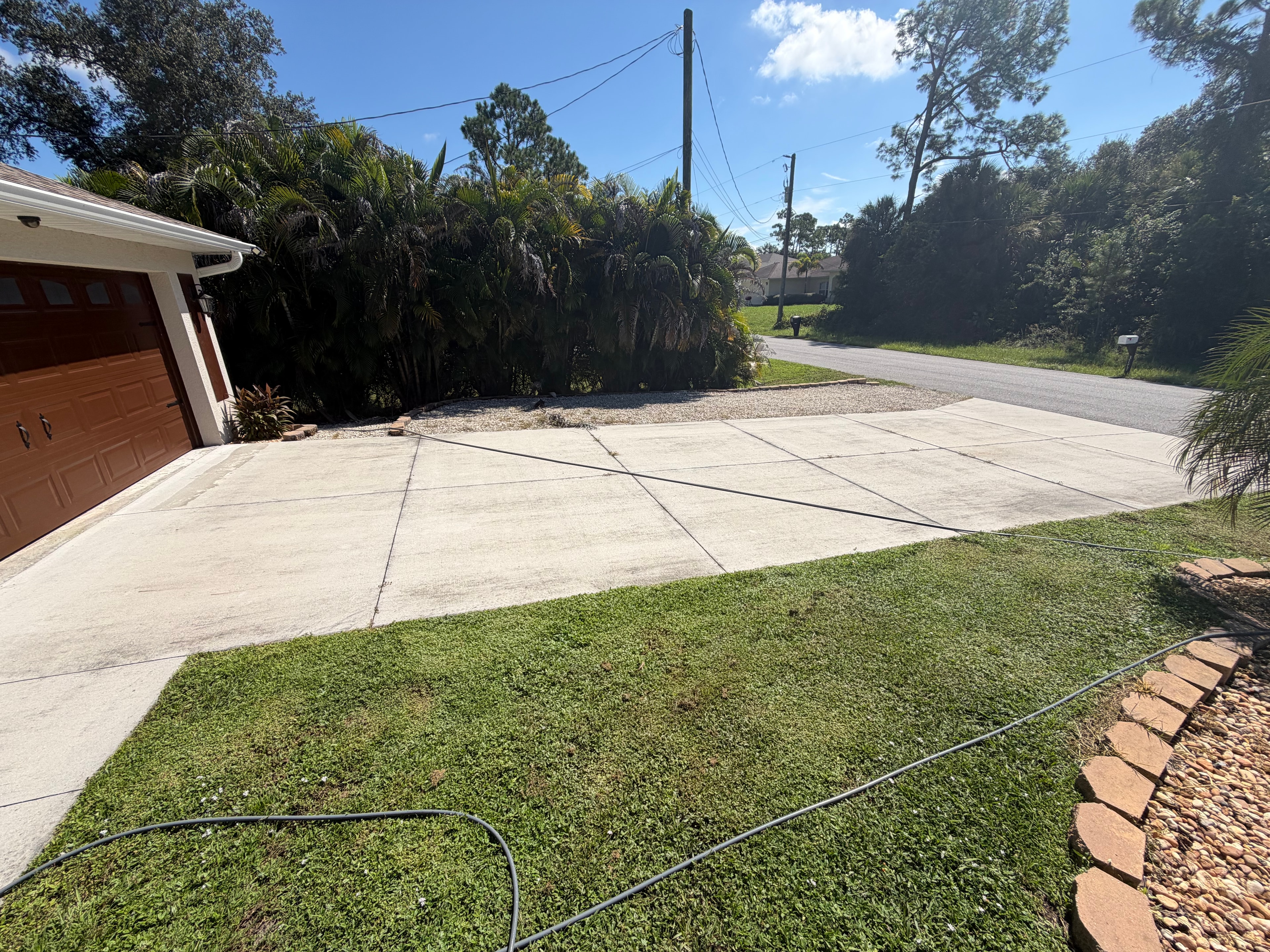 Stained driveway before pressure washing